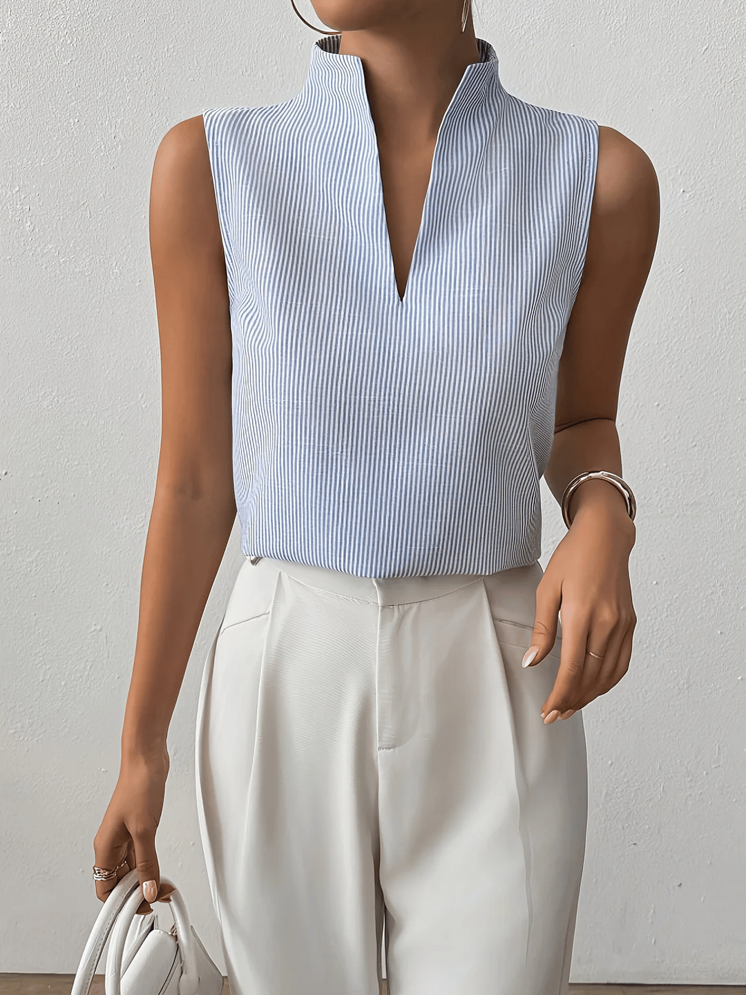 Sleeveless blouse for women with striped pattern | Elegant business top with stand-up collar and V-neck for the office