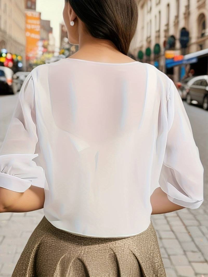Transparent women's blouse with tie knot and 3/4 sleeves