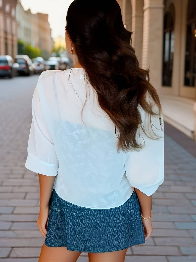 Transparent women's blouse with tie knot and 3/4 sleeves
