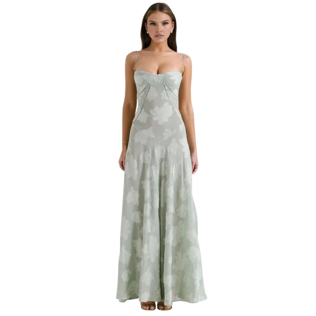 Woman wearing a strapless, floor-length Kouvr dress with a subtle pattern on a white background
