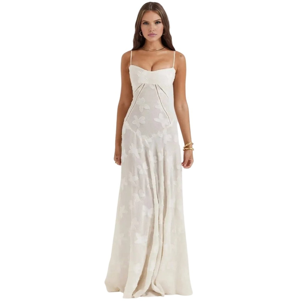 Woman wearing a white Kouvr strapless dress on a white background