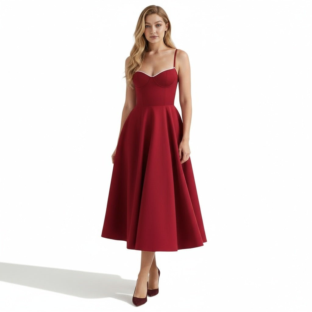  Model wearing Kouvr Fashion red bustier midi dress with sweetheart neckline, front view.