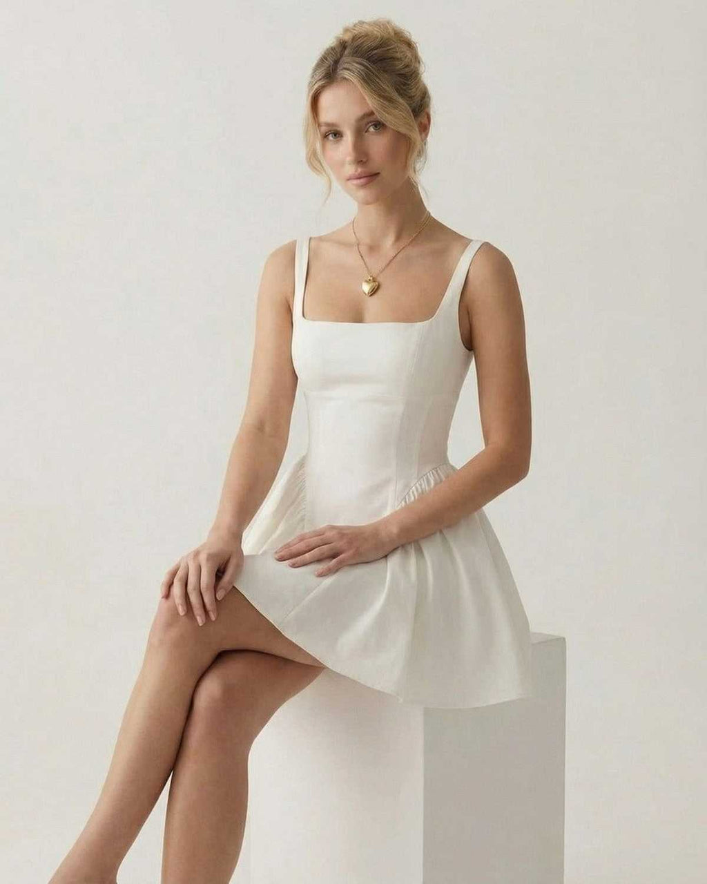 Aurora Mini Dress by Lauven - Stylish square neck backless mini dress with bow detail and A-line shape.