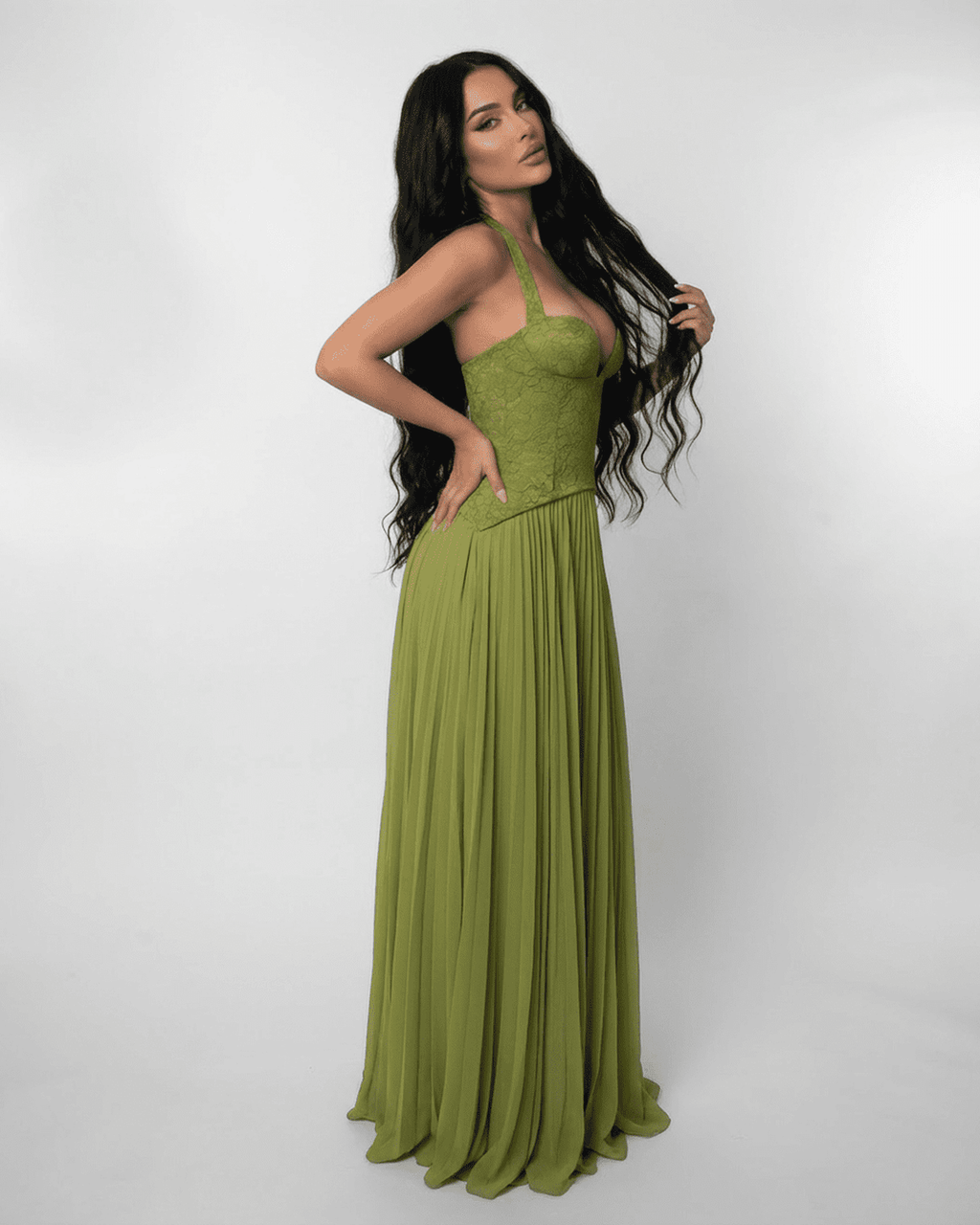 Lauven Verdant Maxi Dress featuring a lace bodice and pleated olive green skirt, ideal for elegant occasions.